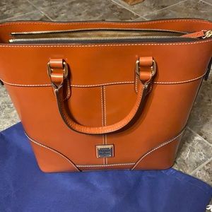 Brand new, never carried Dooney and Bourke